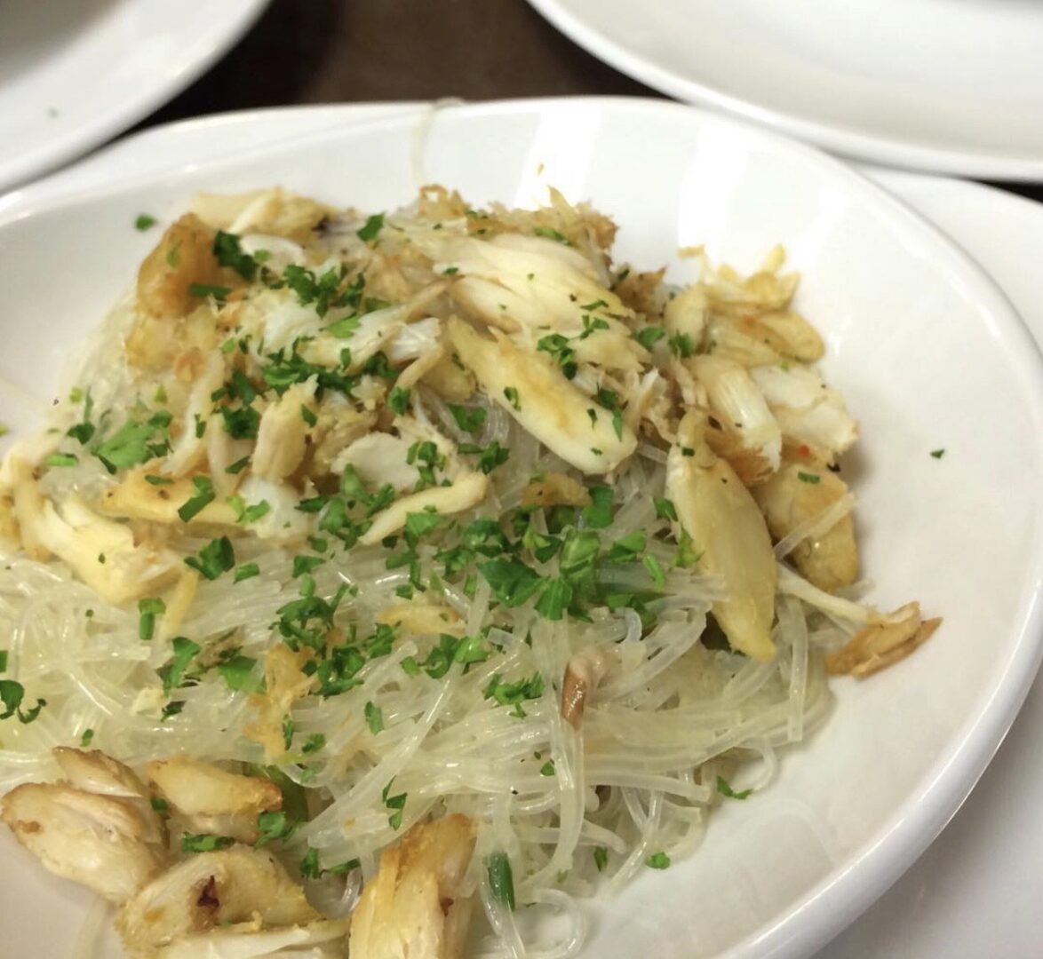 A plate of food with noodles and mushrooms.