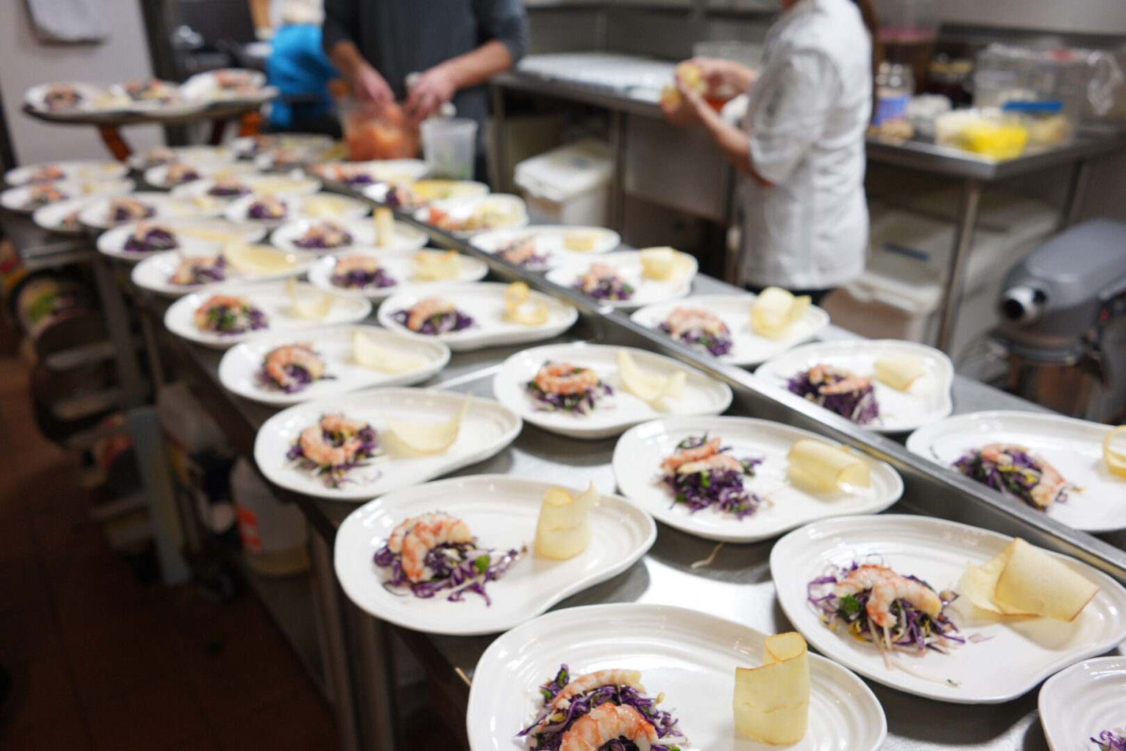 A table full of plates with food on them.