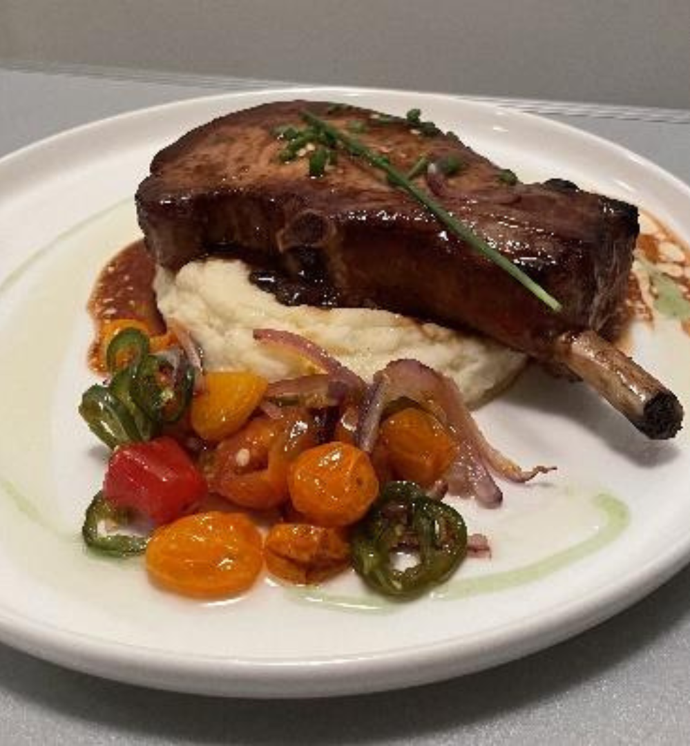 A plate of food with meat and vegetables on it.