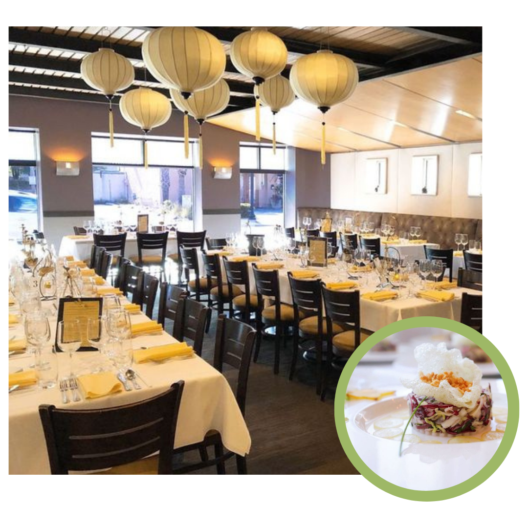 A restaurant with tables and chairs set up for dinner.